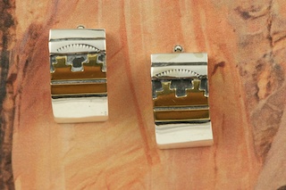 Sterling Silver Post Earrings with 12K Gold fill Pueblo Design. Created by Navajo Artist Tommy Singer. Signed by the artist.